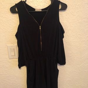 Black open shoulder romper. Size XL. Has pockets